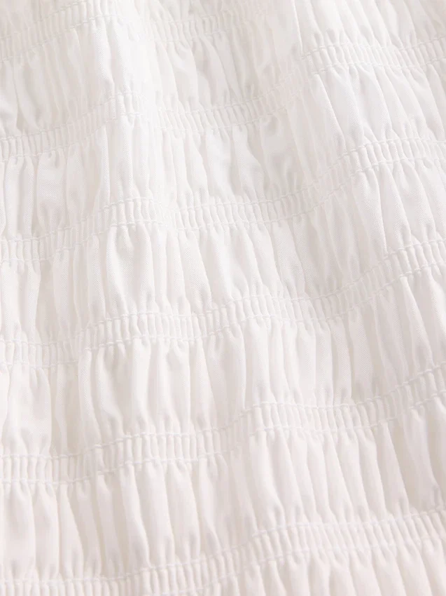 Peplumtop met smockwerk voor kinderen