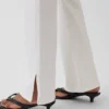 Relaxte rechte Jeans met middelhoge taille en gespleten zoom