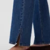 Relaxte rechte Jeans met middelhoge taille en gespleten zoom