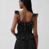 Top met fladdermouwtjes en strik in de taille