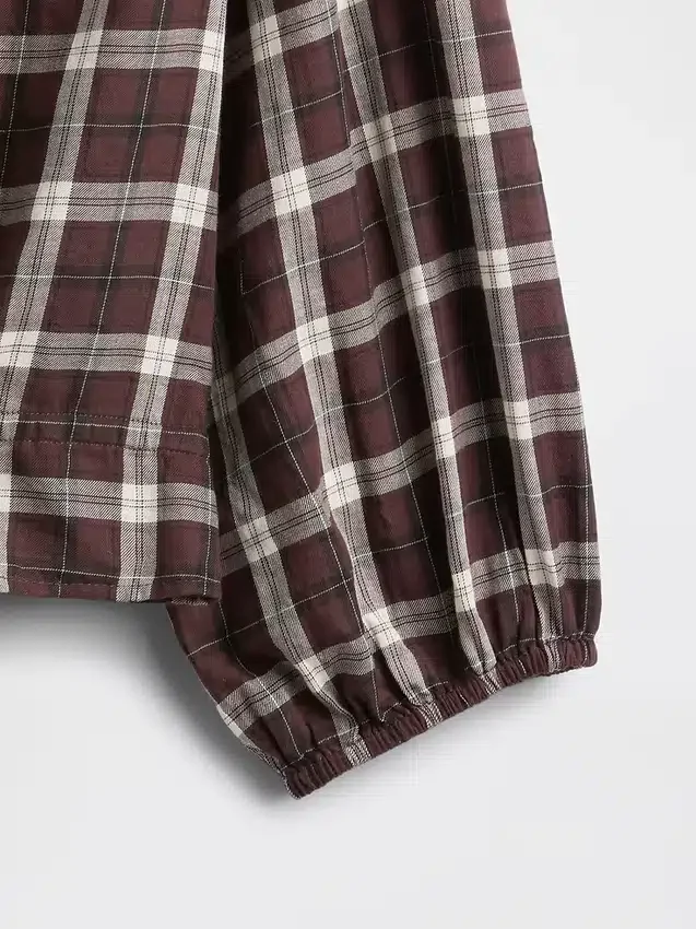 Top met geruite print en strik in de taille