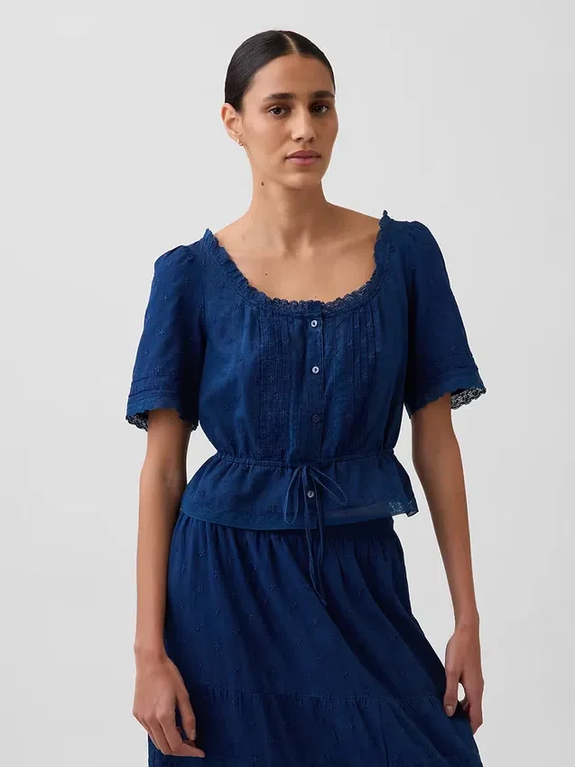 Top met peplum en kanten rand