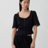 Top met peplum en kanten rand