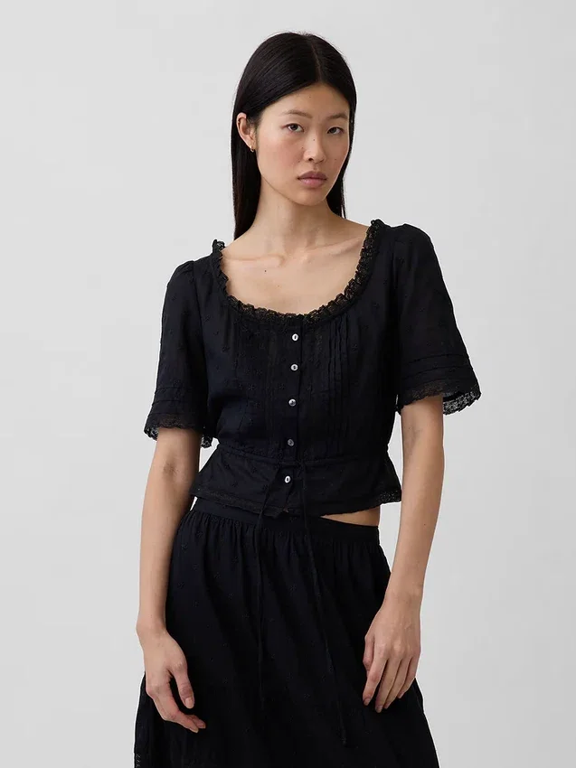 Top met peplum en kanten rand