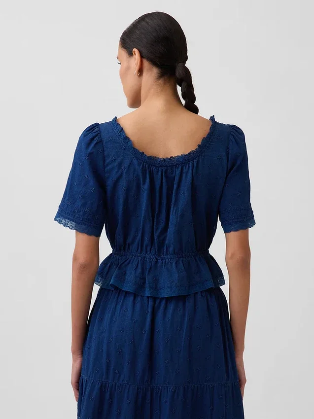 Top met peplum en kanten rand