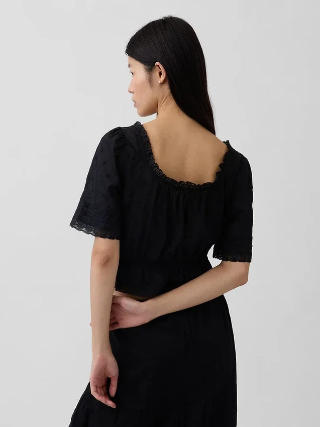 Top met peplum en kanten rand