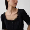 Top met peplum en kanten rand