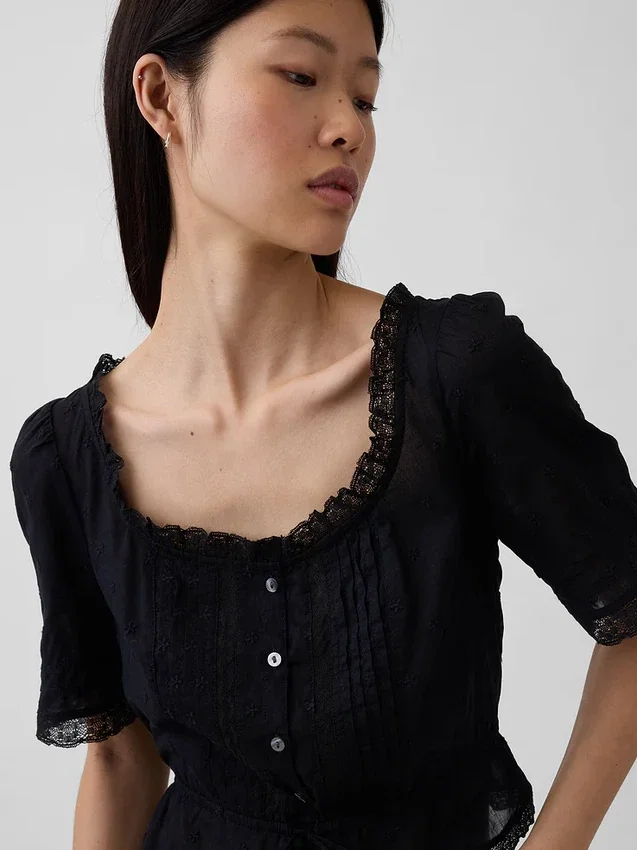 Top met peplum en kanten rand