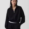 Vintagesoft oversized pullover met halve rits en wigvormige hals