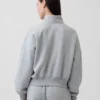 Vintagesoft oversized pullover met halve rits en wigvormige hals