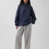 Zware oversized pullover met logo en kwartritssluiting